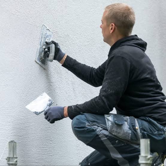 Rendering being applied to an external wall